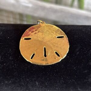 Sand Dollar Pendant Gold Tone, Seashell Beach Ocean Charm. 1 1/4” x 7/8”.